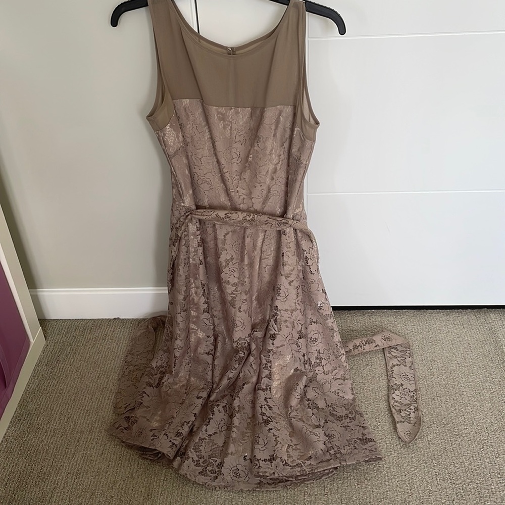 Lacy sleeveless tan/neutral colored dress